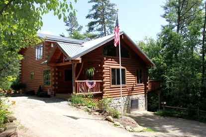 Deluxe Log Cabin with a Hot Tub in the Smoky Mountains of North Carolina - glamping.directory