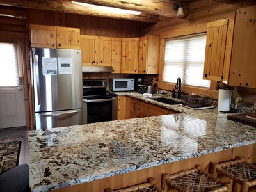 Spacious Log Cabin Retreat with Game Room & Hot Tub Near Island Park, Idaho - Idaho City, Idaho - glamping.directory
