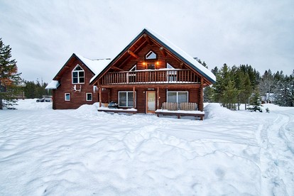 Spacious Log Cabin Retreat with Game Room & Hot Tub Near Island Park, Idaho - glamping.directory