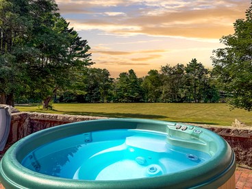Secluded Group Retreat with Hot Tub, Riverfront & Huge Yard in Conway, New Hampshire - Conway, New Hampshire - glamping.directory