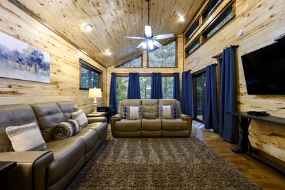 Modern Two-Story Cabin with Hot Tub, Game Loft & Fire Pit in Southeast Oklahoma - Broken Bow, Oklahoma - glamping.directory