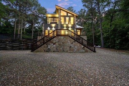 Modern Two-Story Cabin with Hot Tub, Game Loft & Fire Pit in Southeast Oklahoma - Broken Bow, Oklahoma - glamping.directory