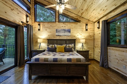 Modern Two-Story Cabin with Hot Tub, Game Loft & Fire Pit in Southeast Oklahoma - Broken Bow, Oklahoma - glamping.directory