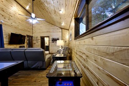 Modern Two-Story Cabin with Hot Tub, Game Loft & Fire Pit in Southeast Oklahoma - Broken Bow, Oklahoma - glamping.directory