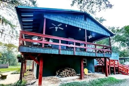 Lakefront Family Cabin with Jacuzzi, Fire Pit and Yard in Texas - glamping.directory