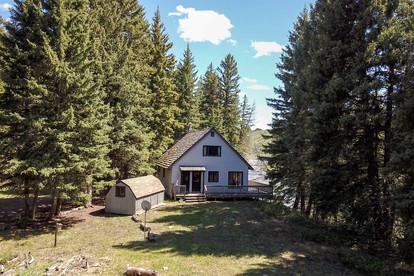 Charming Riverside Cabin with Deck Overlooking Madison River near Three Dollar Bridge in McAllister, Montana - glamping.directory
