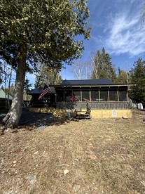 Charming Lakeside Cabin Bungalow with Timeless Rustic Beauty near Portage Lake in Maine - Portage Lake, Maine - glamping.directory