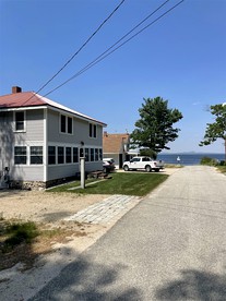 Waterfront Cottage with Firepit and Beautiful Outdoor Space in Sebago, Maine - glamping.directory