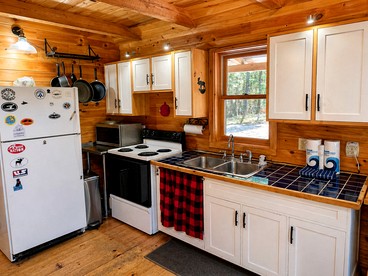 Rustic-Chic Cabin Getaway with Trails, Stream & Peaceful Setting in Shirley, Maine - Shirley, Maine - glamping.directory