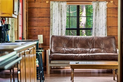 Beautiful Rustic Cabin with Jacuzzi, Covered Porch and Mountain Views in Sevierville, Tennessee - glamping.directory