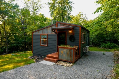 Off-Grid Cabin Surrounded by Trees in Pineville, Missouri - glamping.directory