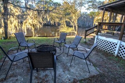 Riverfront Cottage with Fire Pit and Cozy Interior Perfect for Groups in Texas - Karnack, Texas - glamping.directory