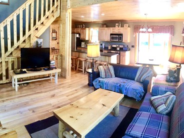 Cozy and Spacious Log Cabin Rental near Burt Lake State Park in Michigan - Indian River, Michigan - glamping.directory