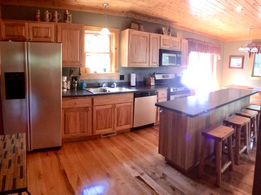 Cozy and Spacious Log Cabin Rental near Burt Lake State Park in Michigan - Indian River, Michigan - glamping.directory