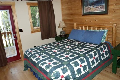 Cozy and Spacious Log Cabin Rental near Burt Lake State Park in Michigan - Indian River, Michigan - glamping.directory