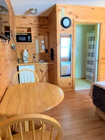 Modern Cabin with Gorgeous Wood Paneled Walls Nestled in the Scenic Beauty of the Ozarks - Mountain View, Arkansas - glamping.directory