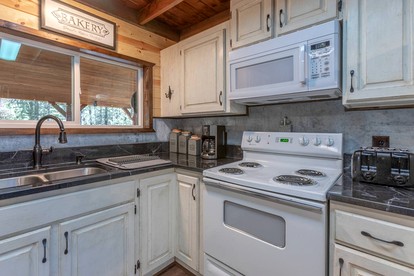 Spacious Rustic Cabin with Hot Tub and Game Loft Near Trails in Island Park, Idaho - Idaho City, Idaho - glamping.directory