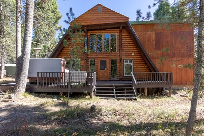 Spacious Rustic Cabin with Hot Tub and Game Loft Near Trails in Island Park, Idaho - glamping.directory