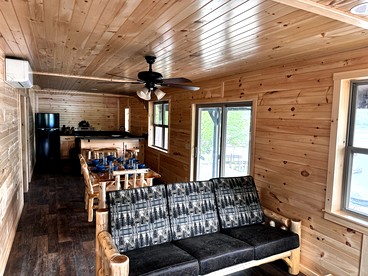 Charming Lakeside Cabin on Big Moose Lake with Breathtaking Views for a Memorable Getaway in New York - glamping.directory