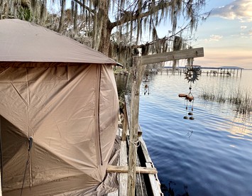 Waterfront Glamping Tent at Clothing Optional Glamping Resort on Lake George, Flordia - Seville, Florida - glamping.directory