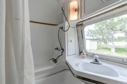 Newly Renovated Camper with Fresh Decor and Tiny Deck in Texas - Spicewood, Texas - glamping.directory