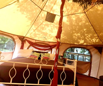 Rustic Bell Tent Rental with a Fire Pit for a Glamping Getaway in Nature near San Antonio, Texas - Pipe Creek, Texas - glamping.directory