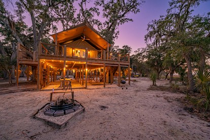 Secluded Treehouse Tent Retreat on the Marsh with Outdoor Dining, Grilling Gear, Games, Views in Townsend, Georgia - glamping.directory