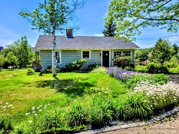 Picturesque Waterfront Cottage with Waterfall Views, Fireplace & Deck, Near Acadia National Park in Gouldsboro, Maine - glamping.directory