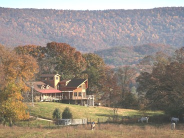 Stately Log Cabin with a Pool for a Group Getaway near Chickamauga, Georgia - glamping.directory