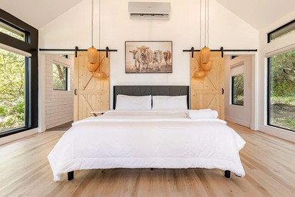 Modern Farmstay Cabin with Friendly Animals, Pond Views & Nature Trails Near Cedar Creek, Texas - Cedar Creek, Texas - glamping.directory