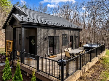 Rustic-Modern Cabin Escape with Hot Tub & Sauna in Great Cacapon, West Virginia - glamping.directory