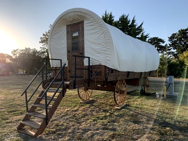 Cozy Covered Wagon for a Unique Glamping Experience in Beaumont, Kansas - glamping.directory