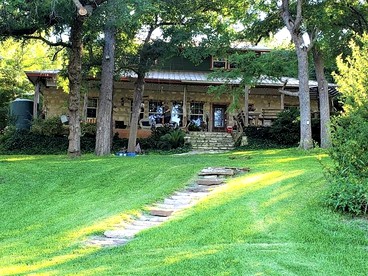 Waterfront Cabin Rental for Groups of 16 with Jacuzzi Bathtub in Texas Hill Country - glamping.directory