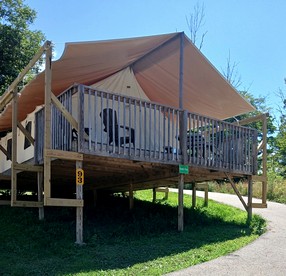 Sensational Tented Cabin Nestled Amidst Trees and Fire Pit Provided in Logan, Ohio - glamping.directory