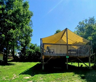 Sensational Tented Cabin Nestled Amidst Trees and Fire Pit Provided in Logan, Ohio - Logan, Ohio - glamping.directory