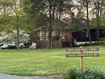 Charming Cabin on Golf Course with Fireplace & Resort Perks in Hedgesville, West Virginia - glamping.directory