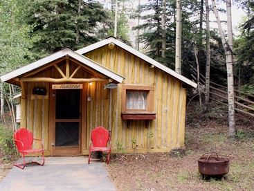 Comfortable Two-Bedroom Log Cabin Rental near Powderhorn, Colorado - glamping.directory