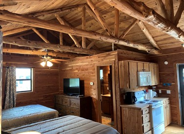 Tranquil Log Cabin by the San Marcos River - A Relaxing Glamping Getaway near Kingsbury, Texas - Kingsbury, Texas - glamping.directory