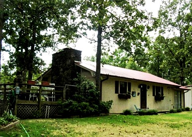 Rustic Cabin Rental in the Woods with Private Dock on Lake Dardanelle, Arkansas - glamping.directory