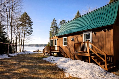 Quiet Waterfront Cabin with Fireplace, Porch & Nature All Around in Greenville, Maine - glamping.directory