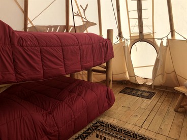Rustic Conestoga Wagon Stay with Lodge Amenities near Boulder Creek, Montana - Hall, Montana - glamping.directory