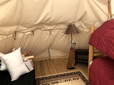 Rustic Conestoga Wagon Stay with Lodge Amenities near Boulder Creek, Montana - Hall, Montana - glamping.directory