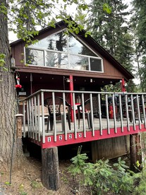 Peaceful Creekside Cabin with Fire Pit & Scenic Deck in Cascade, Idaho - glamping.directory