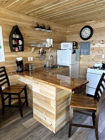 Magnificent Cabin Nestled Amidst Trees in Portage Lake, Maine - Portage Lake, Maine - glamping.directory