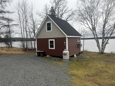 Magnificent Cabin Nestled Amidst Trees in Portage Lake, Maine - glamping.directory