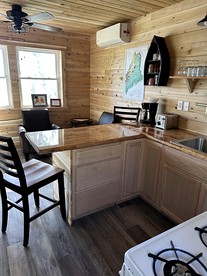 Magnificent Cabin Nestled Amidst Trees in Portage Lake, Maine - Portage Lake, Maine - glamping.directory