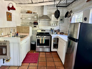 Log Casita Overlooking Pond and Waterfall near Taos, New Mexico - Taos Ski Valley, New Mexico - glamping.directory
