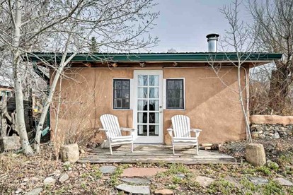 Log Casita Overlooking Pond and Waterfall near Taos, New Mexico - glamping.directory