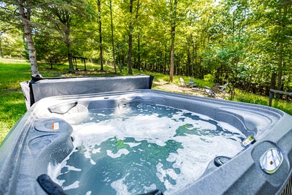 Cozy River Access Cabin with Hot Tub, Fire Pit and Deck Near Great Cacapon State Park in Bloomery, WV - Bloomery, West Virginia - glamping.directory