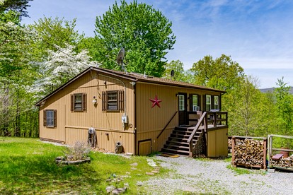 Cozy River Access Cabin with Hot Tub, Fire Pit and Deck Near Great Cacapon State Park in Bloomery, WV - glamping.directory